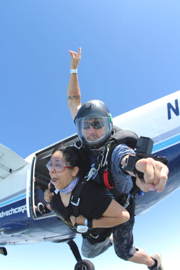 tandem skydiving pair exiting a plane at 13,500' above Ottawa, IL