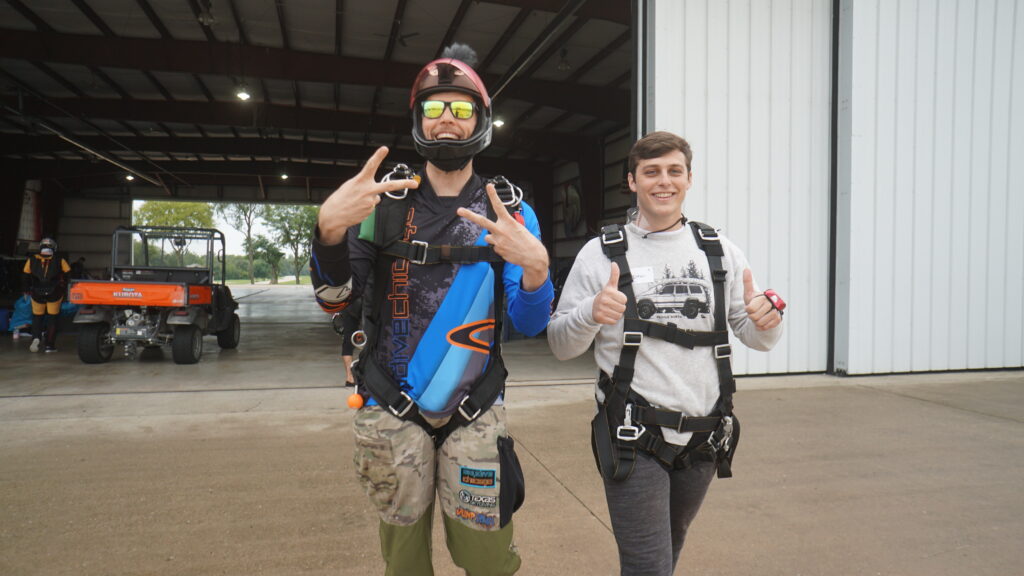 tandem skydiver walking to the plane with instructor at Skydive Chicago