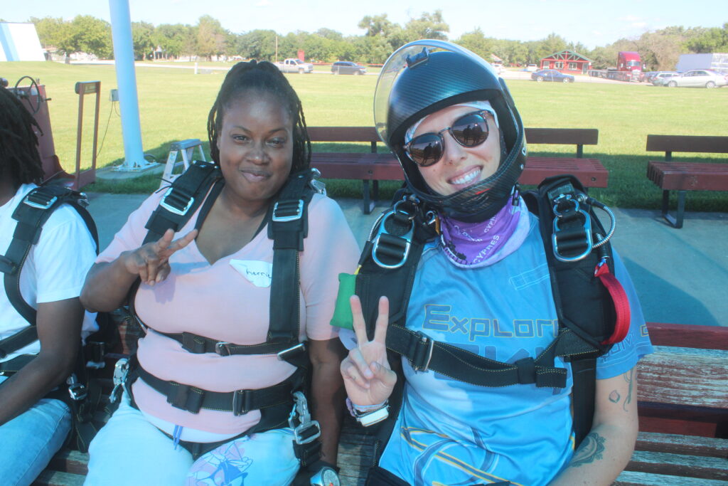 A tandem first jumper and tandem instructor waiting for the plane at Skydive Chicago