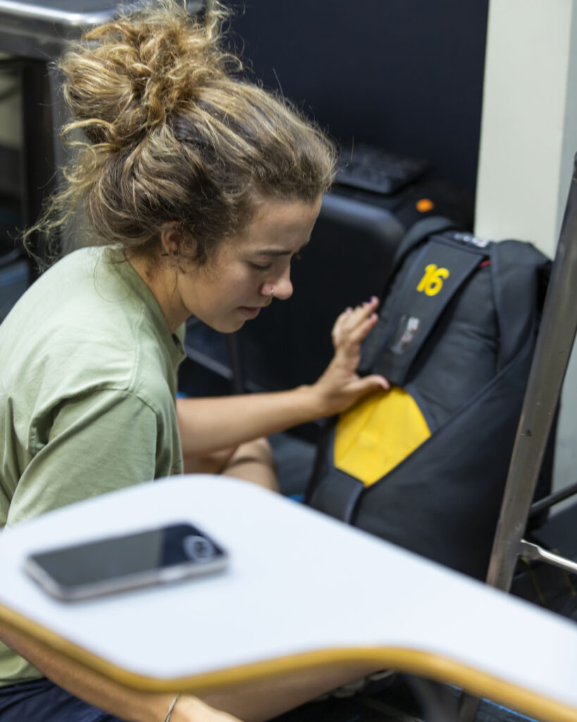 A solo student checking their equipment prior to jumping at Skydive Chicago.